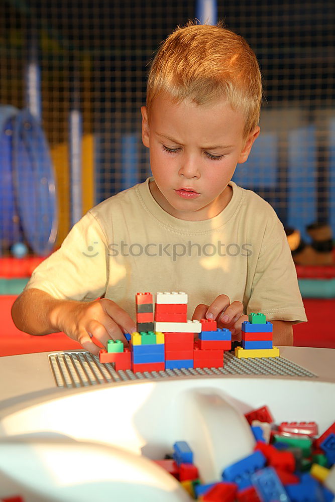 Similar – Image, Stock Photo Happy baby playing with toy blocks.