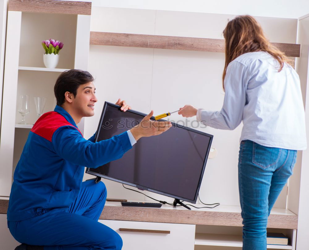 Similar – Image, Stock Photo Interracial couple painting a wardrobe