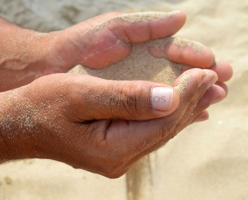 Similar – Child makes sand cake with bucket shape