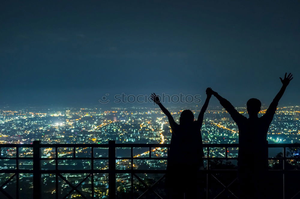 Similar – Gruppe Freunde, die mit Wunderkerzen nachts auf Felsen feiern