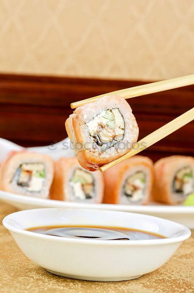 Similar – sushi assortment in white plate on black background