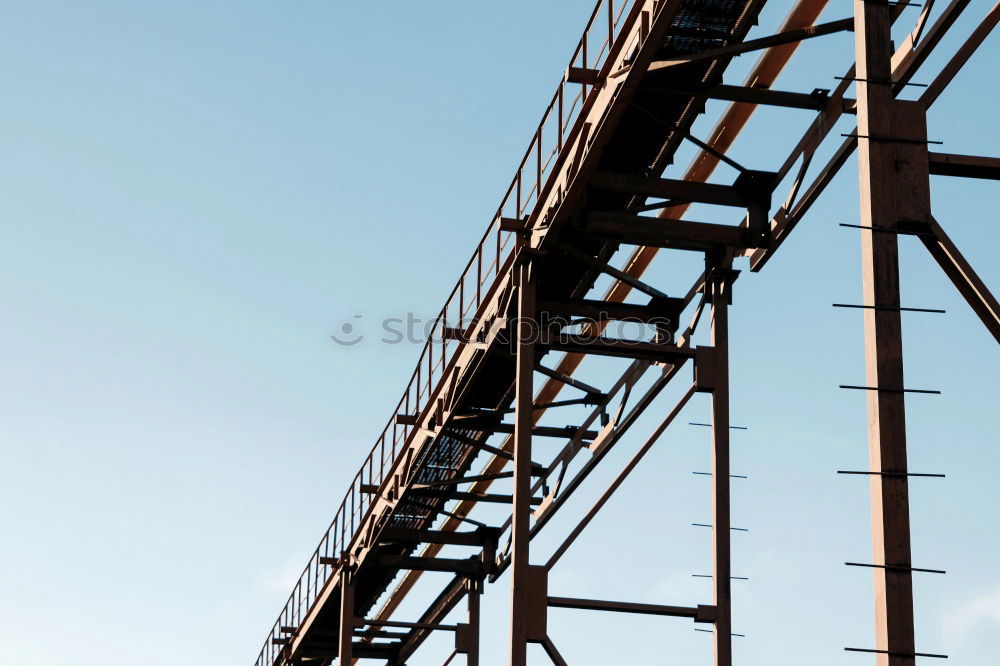 Similar – Power pole from the inside from the frog’s perspective in front of a blue sky