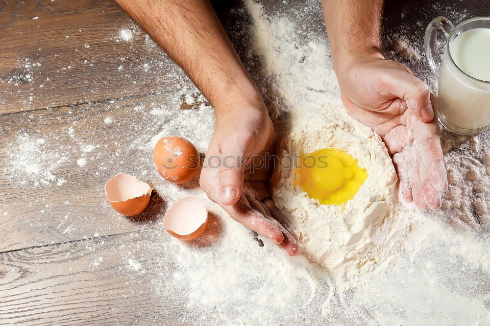 Similar – Image, Stock Photo female hands cut with a knife yeast dough