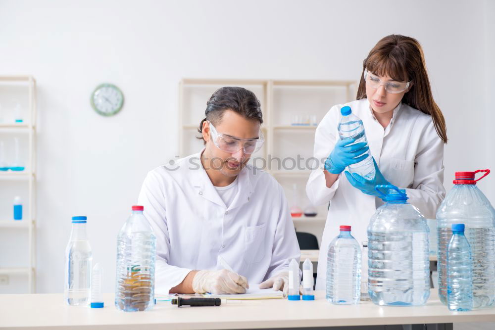 Similar – Image, Stock Photo Woman holding flask in lab