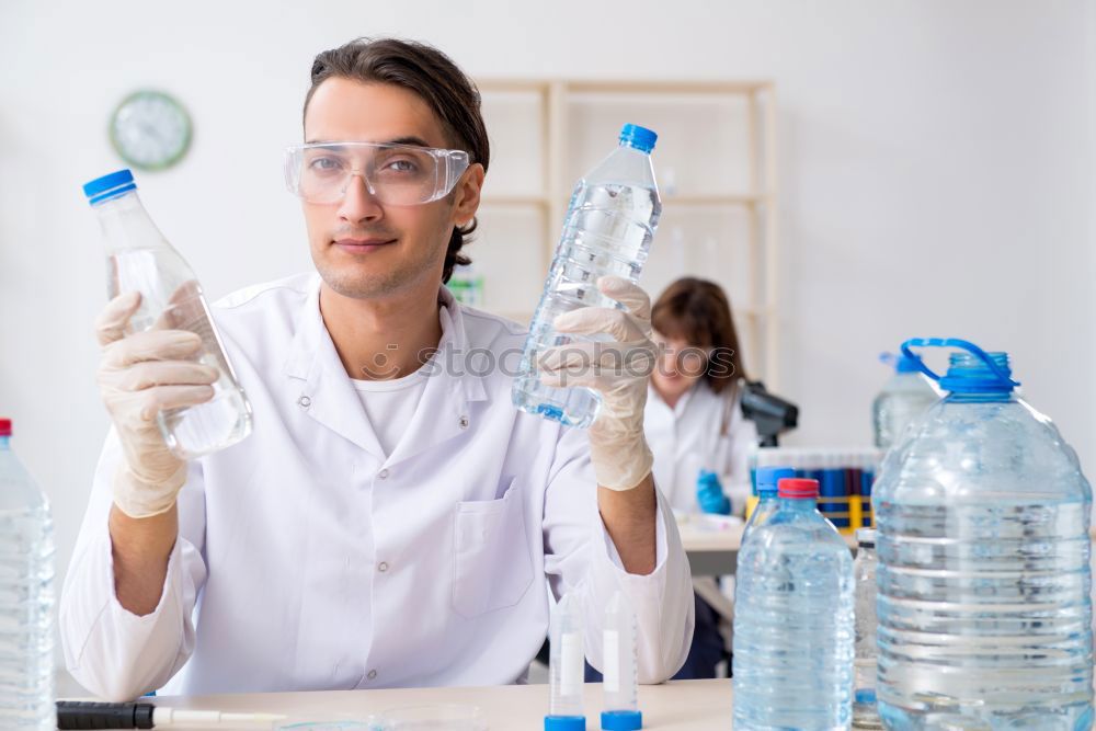 Similar – Image, Stock Photo Woman holding flask in lab