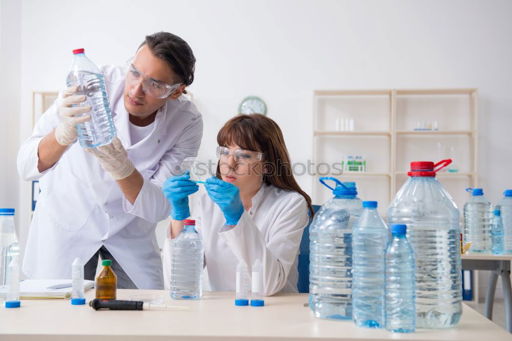 Similar – Image, Stock Photo Woman holding flask in lab