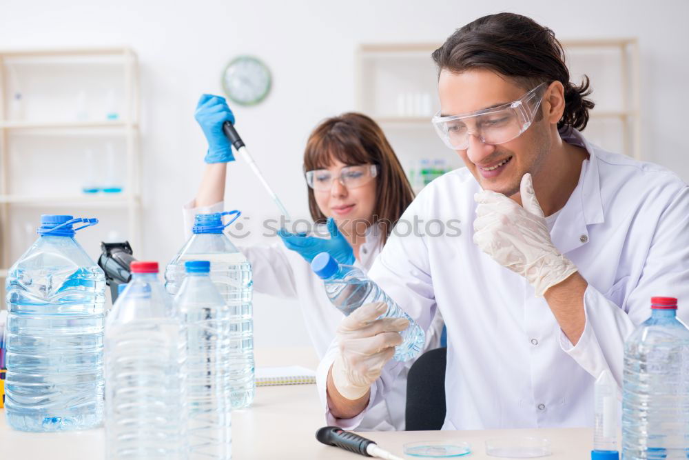 Similar – Image, Stock Photo Woman holding flask in lab