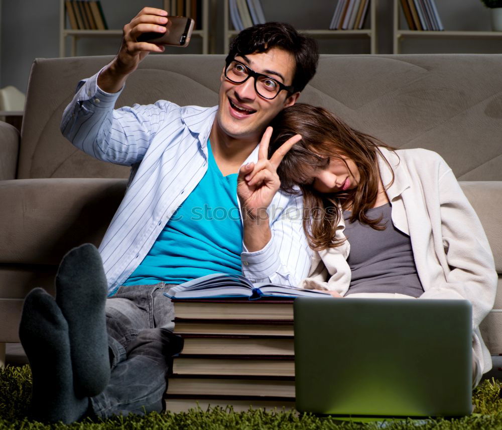 Similar – Image, Stock Photo Young couple reading book on couch at home