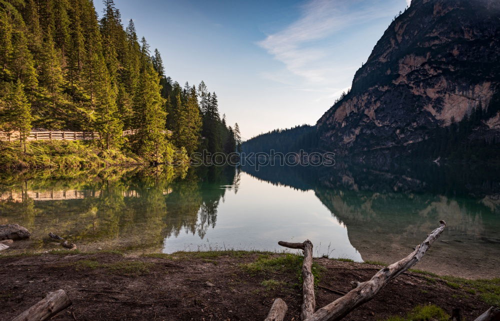 Similar – Mountain lake in coniferous trees