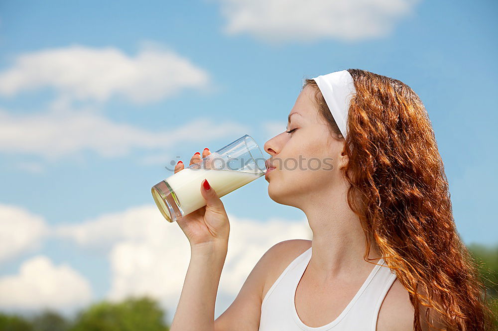 Similar – Fit sporty woman drinking water from a bottle