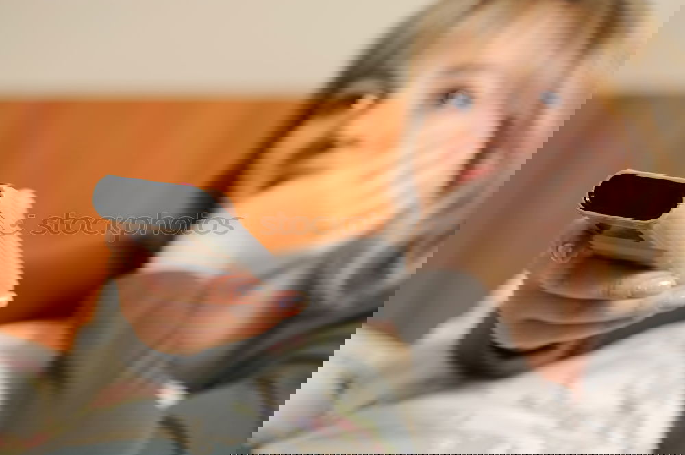 Similar – Image, Stock Photo Young womanbiting nails while sitting on a leather couch