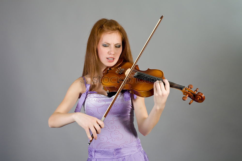 Similar – Image, Stock Photo Pretty young violinist playing the violin