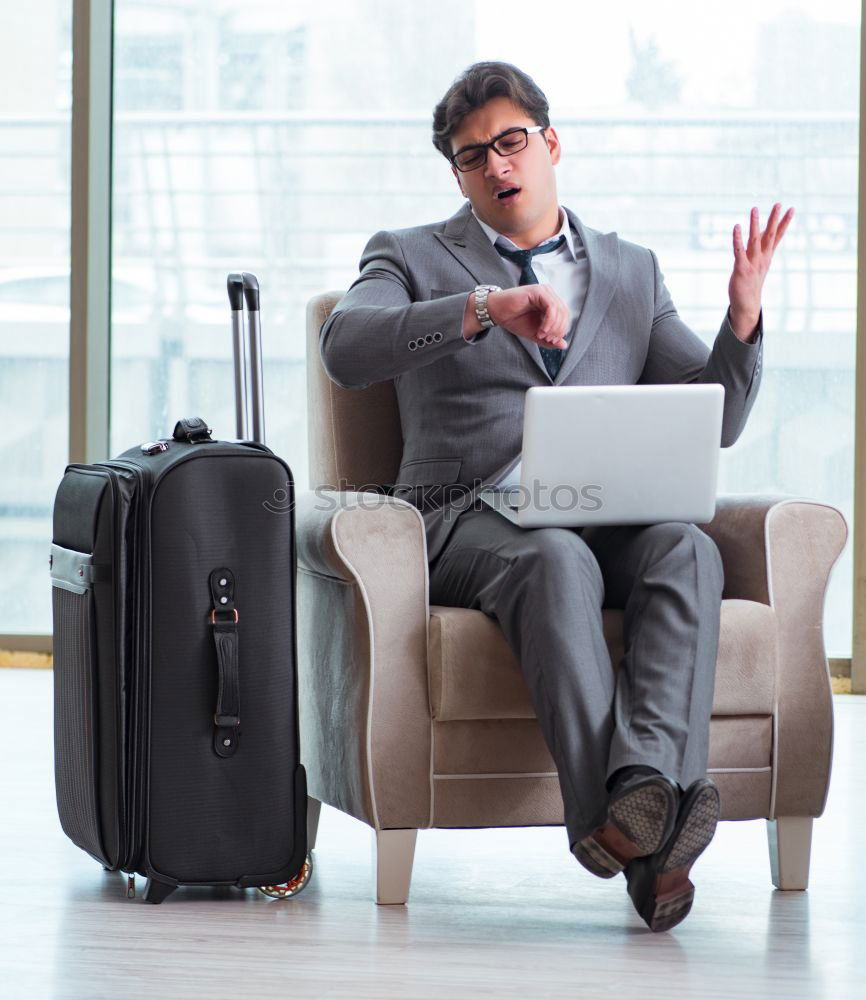 Similar – Image, Stock Photo Young business man standing with the suitcase at the airport waiting for the flight