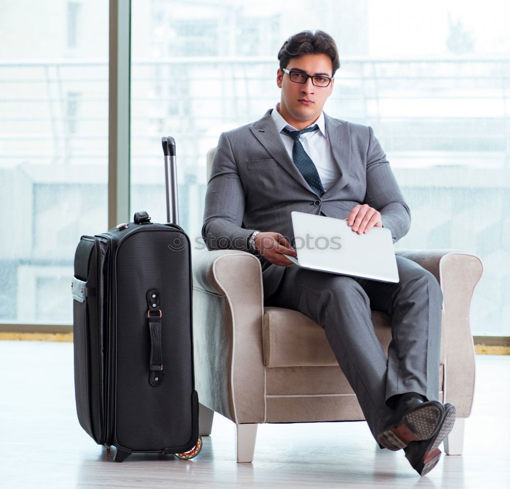 Similar – Image, Stock Photo Young business man standing with the suitcase at the airport waiting for the flight