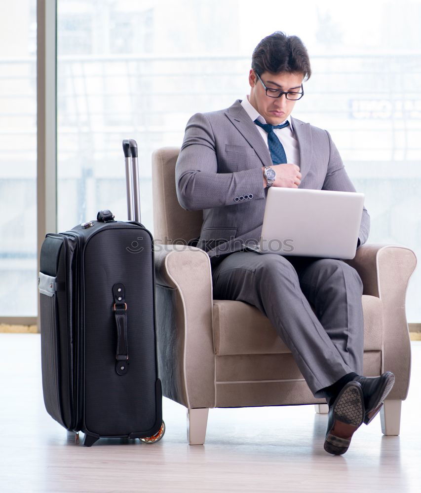 Similar – Image, Stock Photo Young business man standing with the suitcase at the airport waiting for the flight