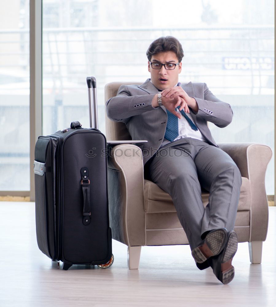 Similar – Image, Stock Photo Young business man standing with the suitcase at the airport waiting for the flight