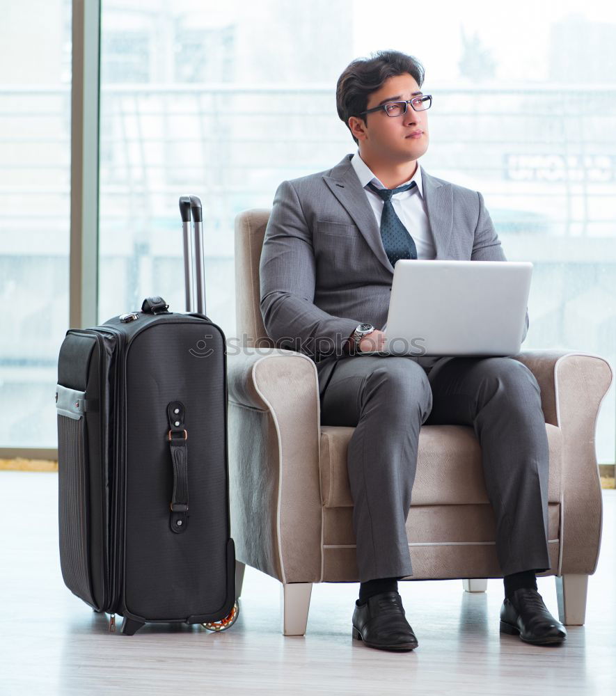 Similar – Image, Stock Photo Young business man standing with the suitcase at the airport waiting for the flight