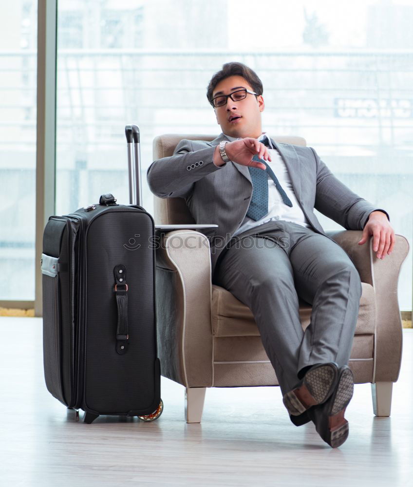 Similar – Image, Stock Photo Young business man sitting at the airport waiting for the flight