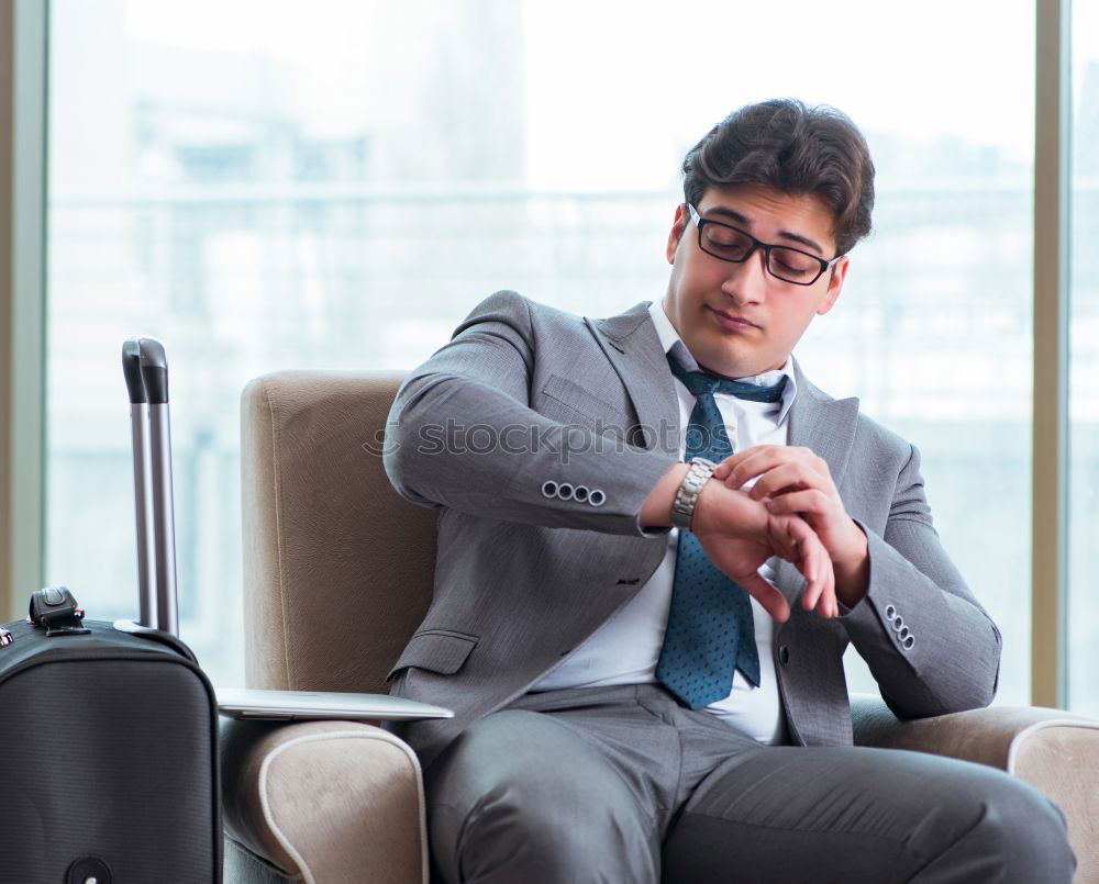 Similar – Image, Stock Photo Young business man sitting at the airport waiting for the flight