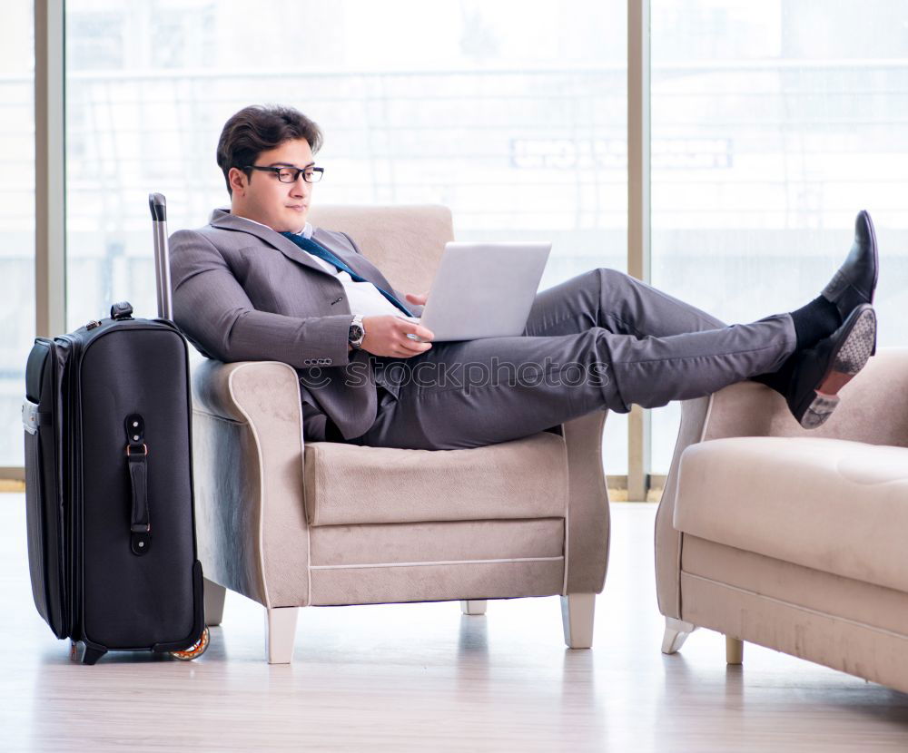Similar – Image, Stock Photo Young business man sitting at the airport waiting for the flight