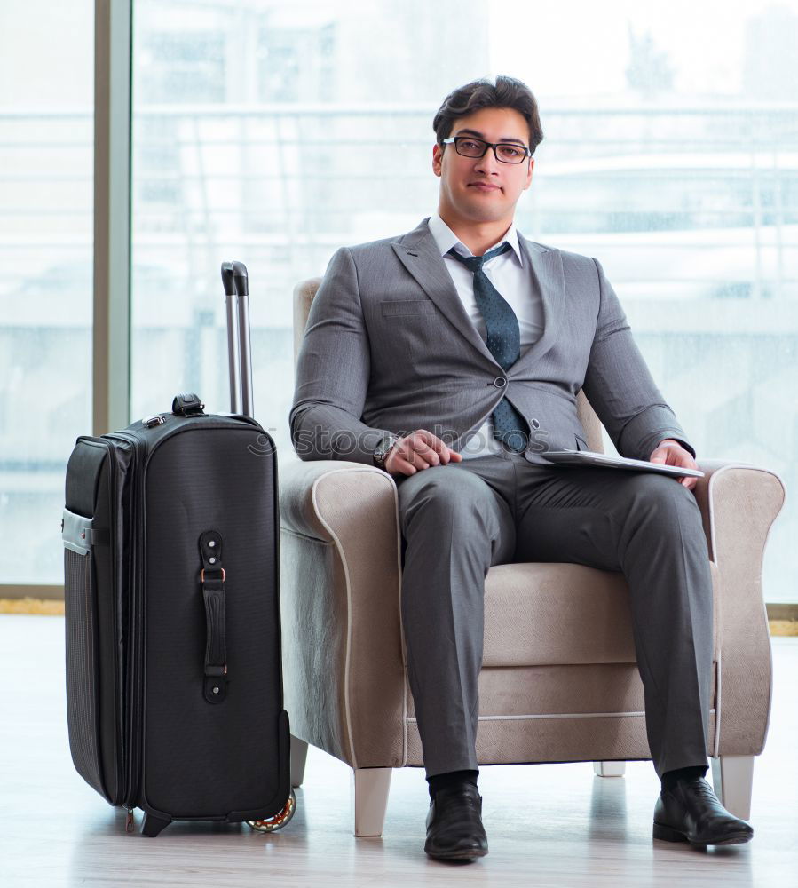 Similar – Image, Stock Photo Young business man sitting at the airport waiting for the flight