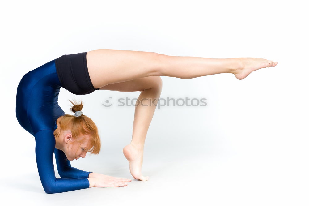 Similar – Group of young sporty sexy women in yoga studio, practicing yoga lesson with instructor, forming a line in Adho mukha svanasana downward dog asana pose. Healthy active lifestyle, working out in gym