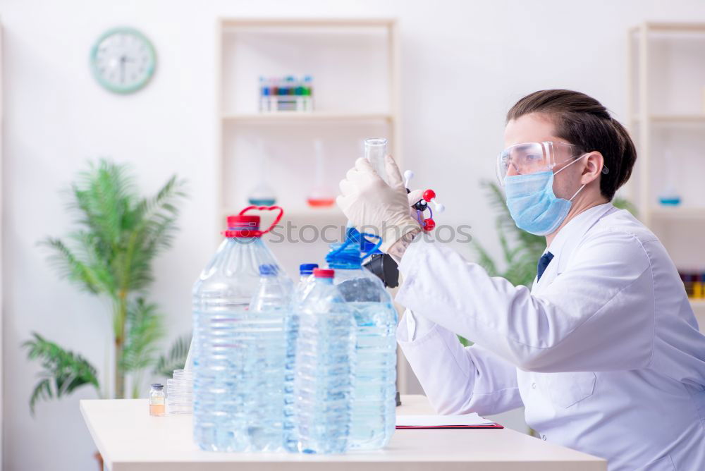 Similar – Image, Stock Photo Woman holding flask in lab