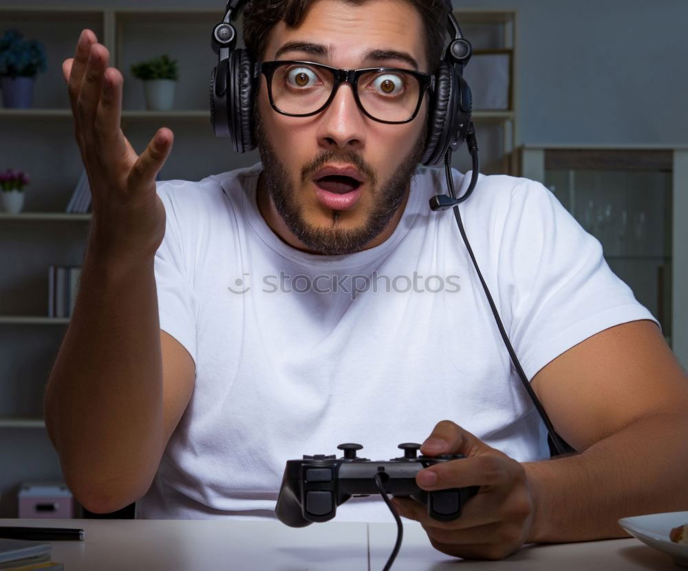 Similar – Young nerd playing video games