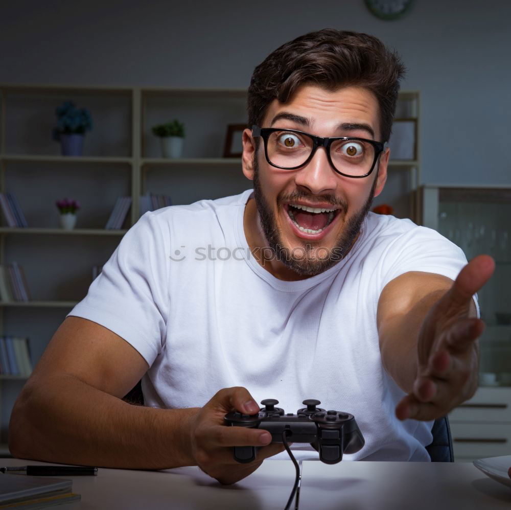 Similar – Young nerd playing video games