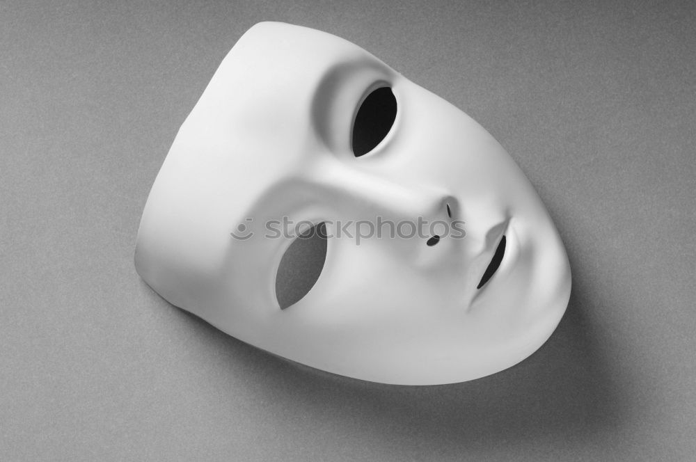 Similar – mysterious woman hides face behind mask