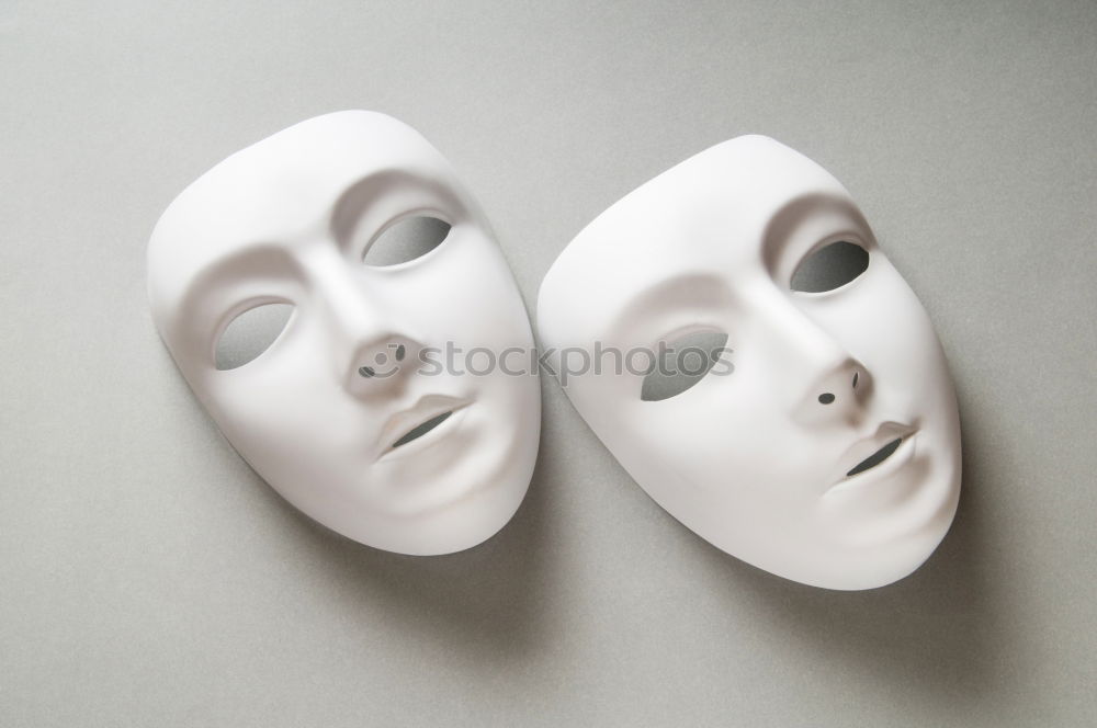 Similar – mysterious woman hides face behind mask