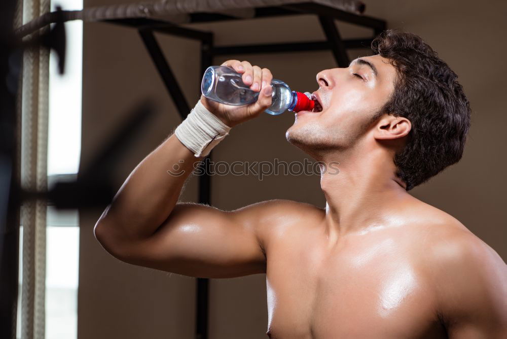 Similar – Man wrapping hands with bandages before boxing training