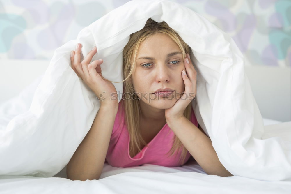 Similar – Portrait of an attractive, young, sexy dark haired woman in Bed, hand and head on the pillow under the blanket, Copy space.