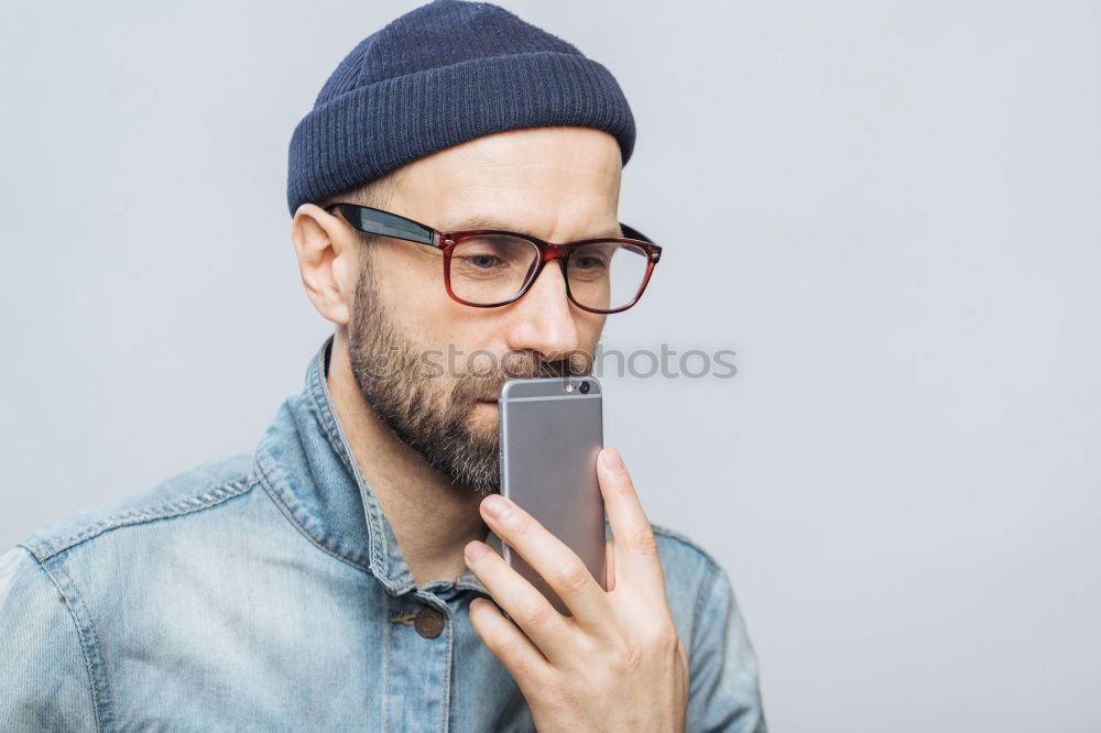 Similar – Image, Stock Photo Portrait of a man with mustache using his smartphone.