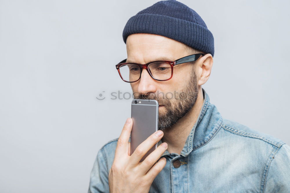 Similar – Image, Stock Photo Portrait of a man with mustache using his smartphone.