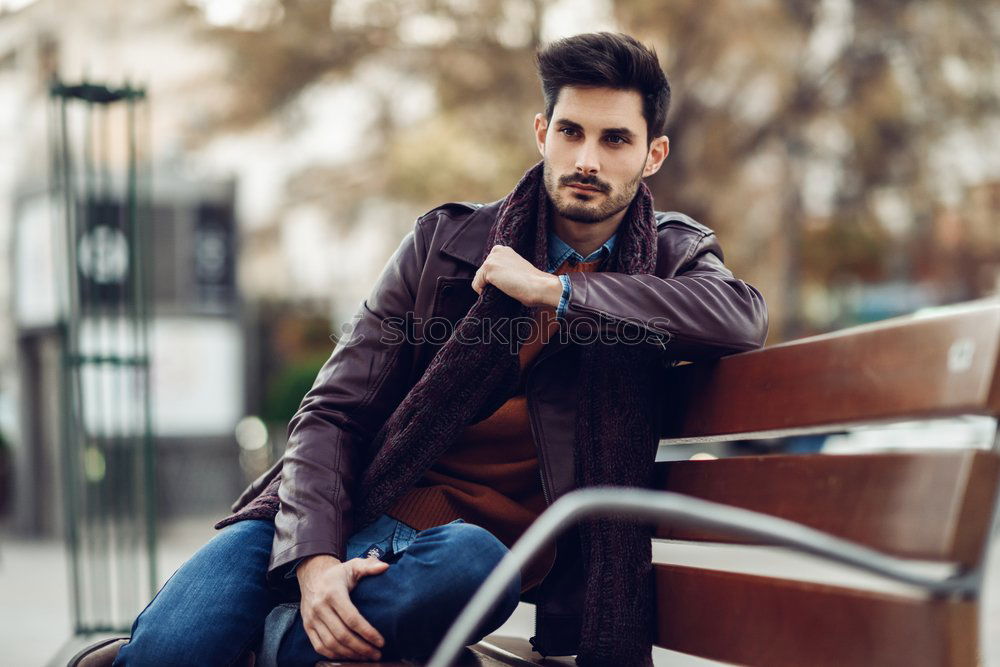 Similar – Young smiling man, model of fashion, wearing a plaid shirt with a green blind behind him