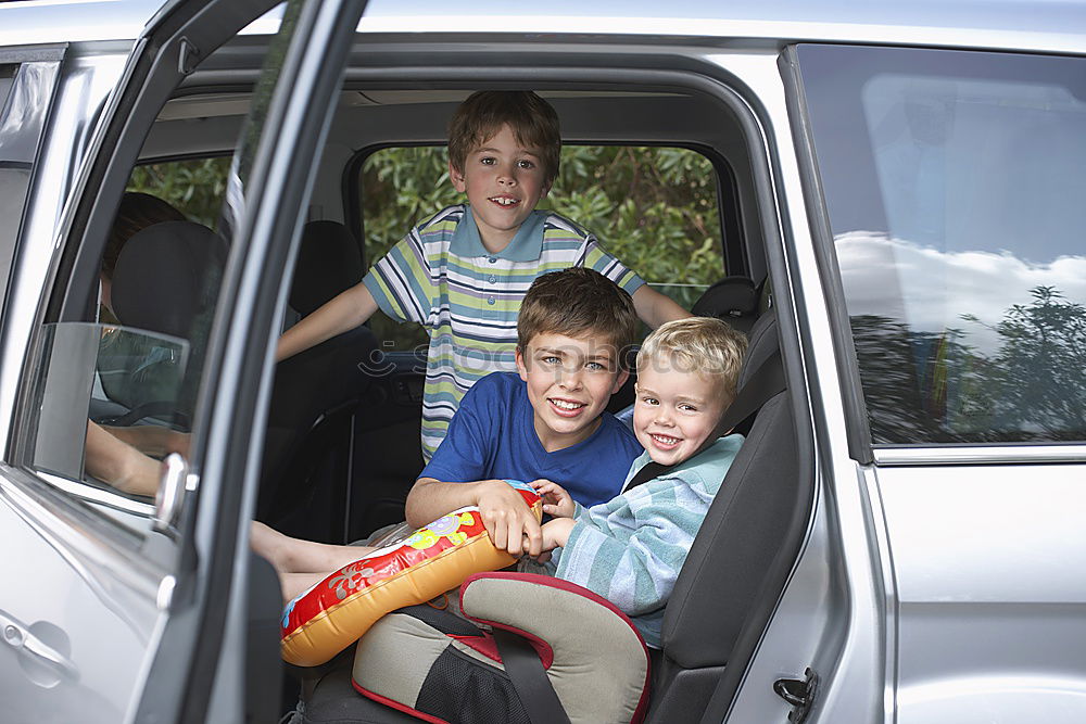 Similar – Happy father and son getting ready for road trip on a sunny day.