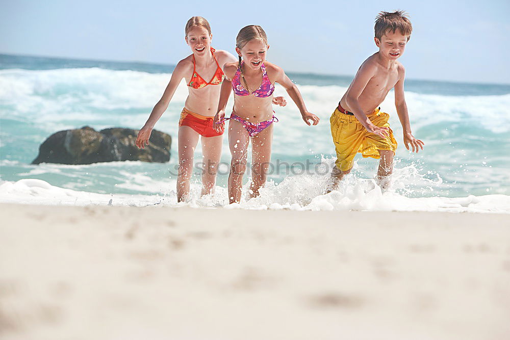 Similar – Two sisters and brother playing on the beach at the day time. Concept Brother And Sister Together Forever