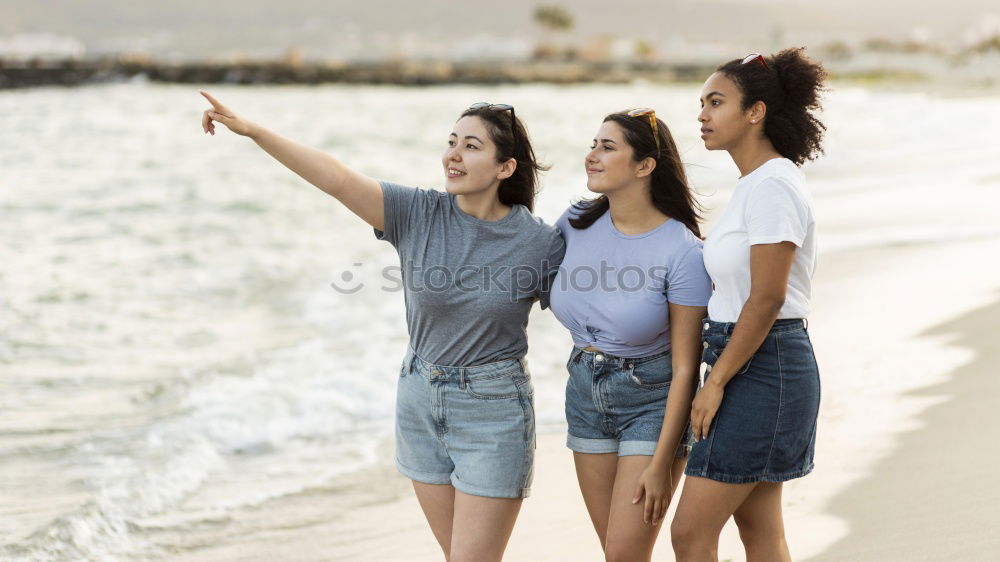 Similar – Group of best friends cheerful on the beach in sunset