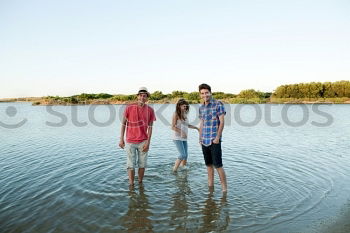 Similar – Image, Stock Photo Happy family standing near the lake at the day time.