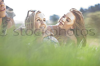 Beautiful women taking a selfie portrait in park.