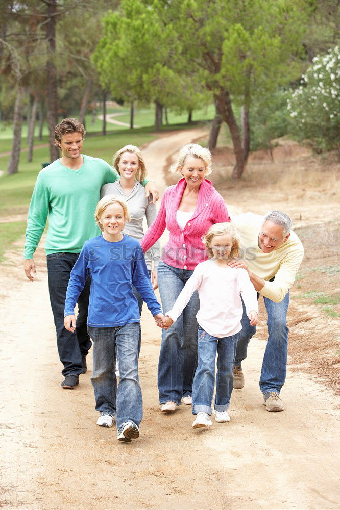 Similar – Image, Stock Photo Father and children walking on the road at the day time.