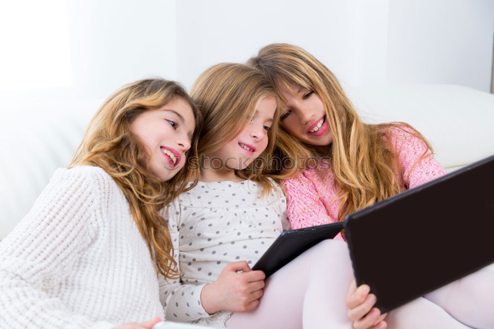 Similar – Three kids using a tablet at home