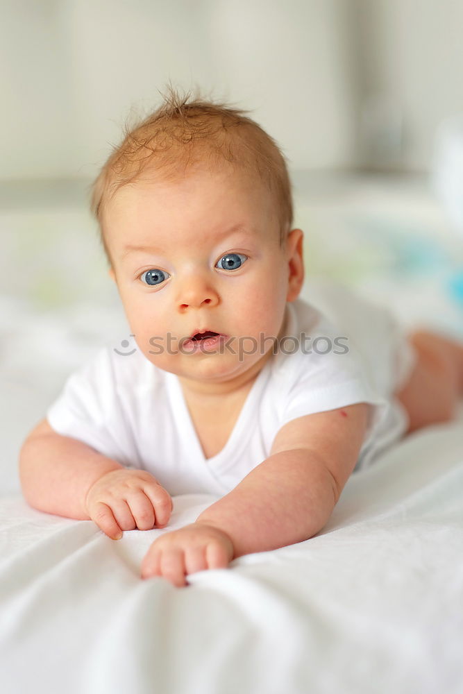 Similar – Cute Baby Girl Lying in the Crib.