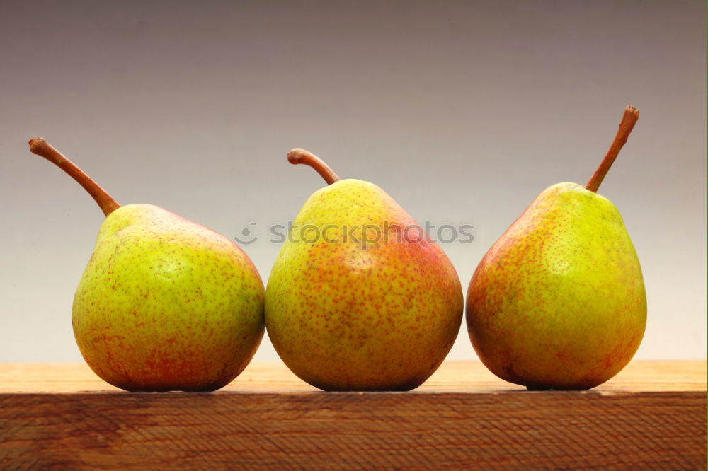 Similar – Image, Stock Photo Eight pears and three tomatoes, regularly arranged on a wooden table