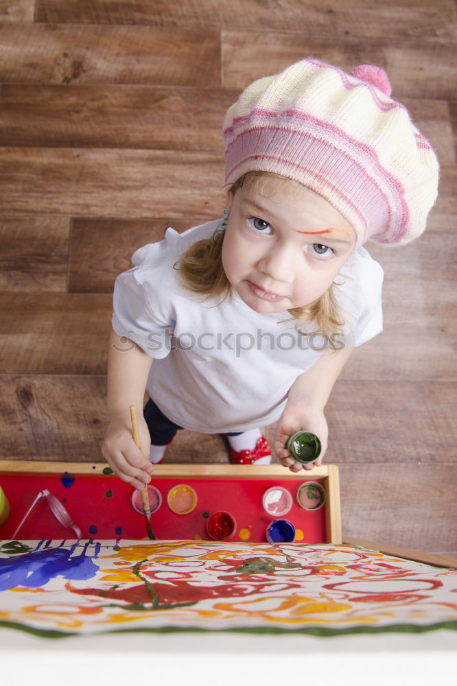 Similar – Girls tying baked Christmas gingerbread cookies with ribbon