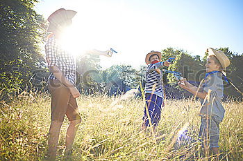 Similar – Image, Stock Photo happy child girl watering flowers with hose in summer