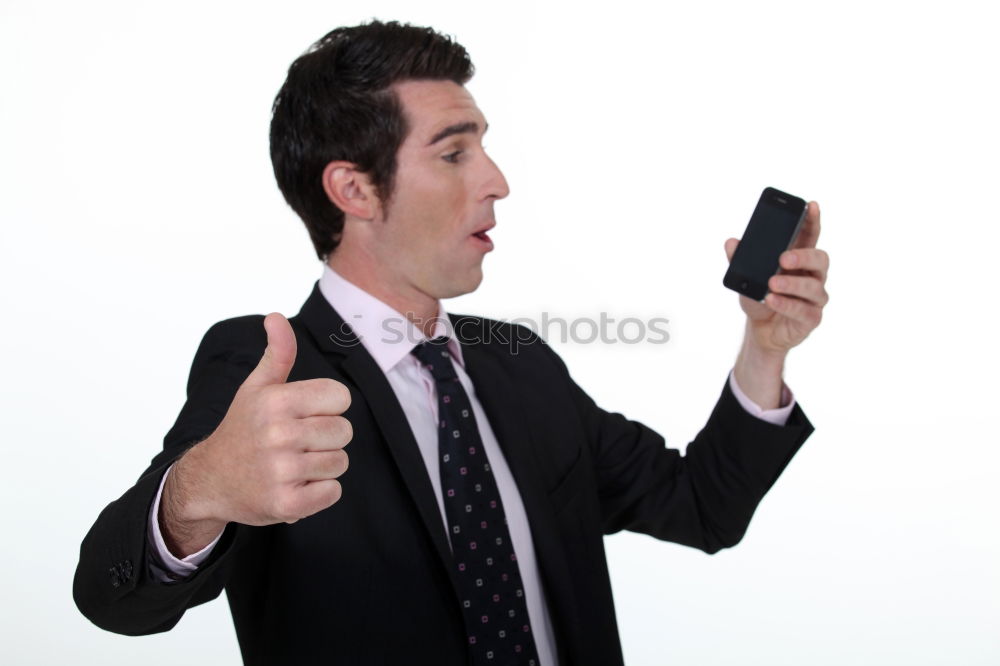 Similar – Business man with mobile phone in his hand