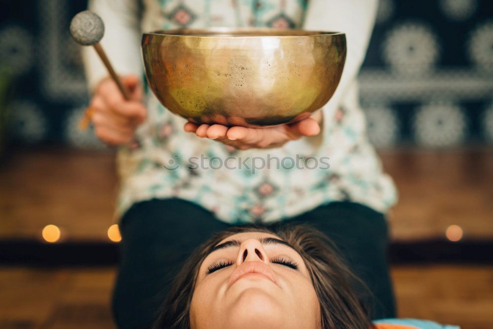 Similar – Image, Stock Photo Hand playing yoga bowls outdoors.