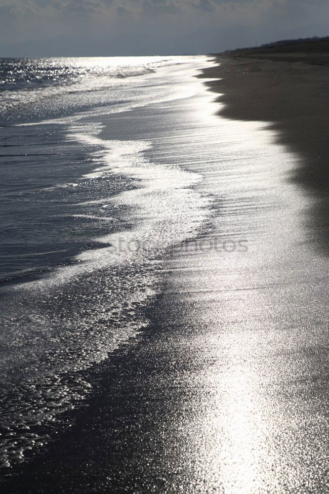 Similar – Landscape on the beach with sea, horizon, sky and sunlight